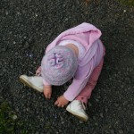 Girl playing with pebbles